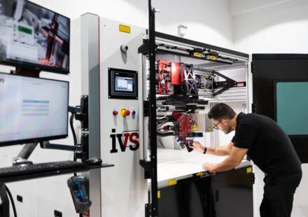 A Man Inspecting the Zytronic Laser Soldering System