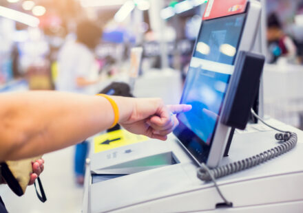 A user using a self service touchscreen