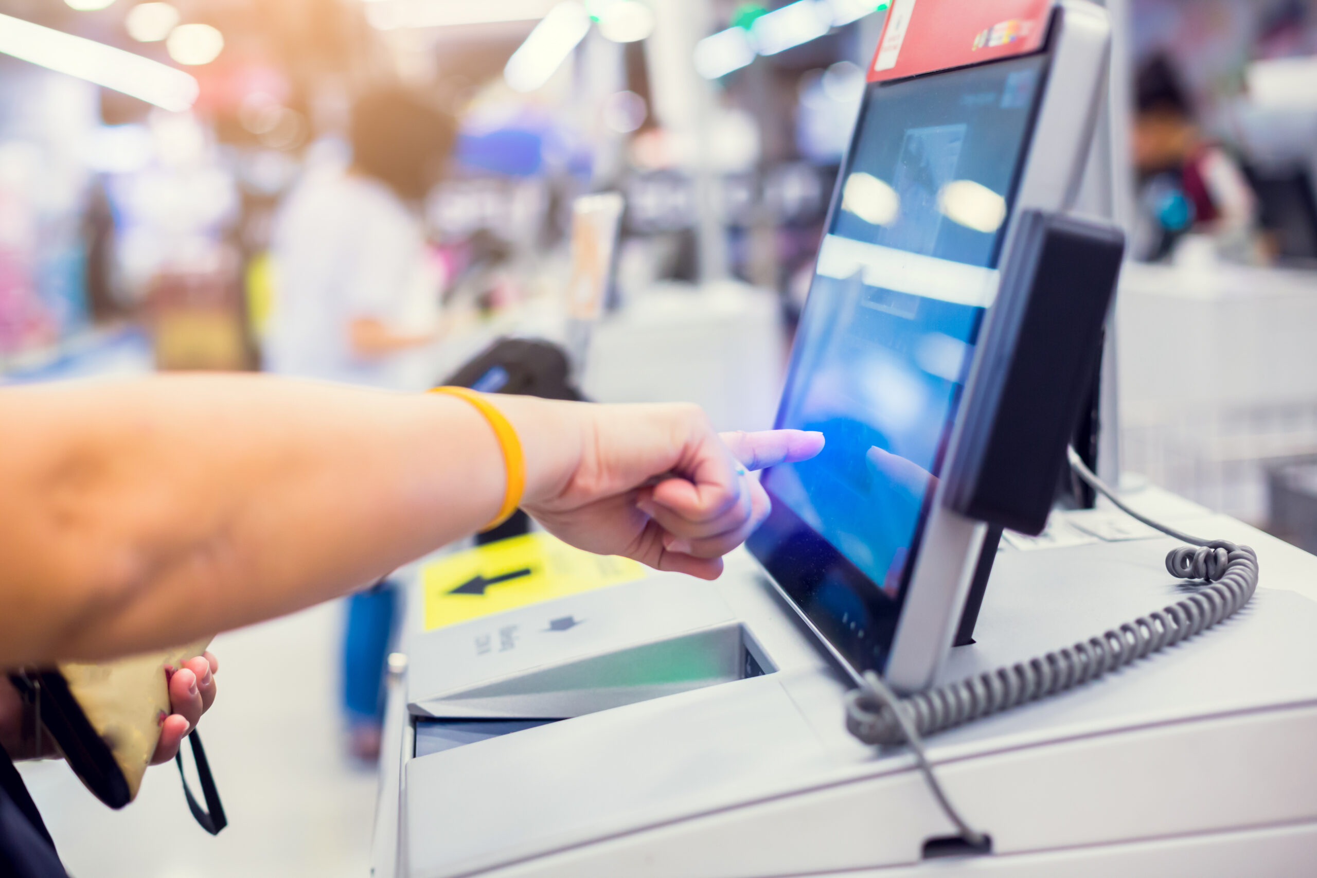 A user using a self service touchscreen