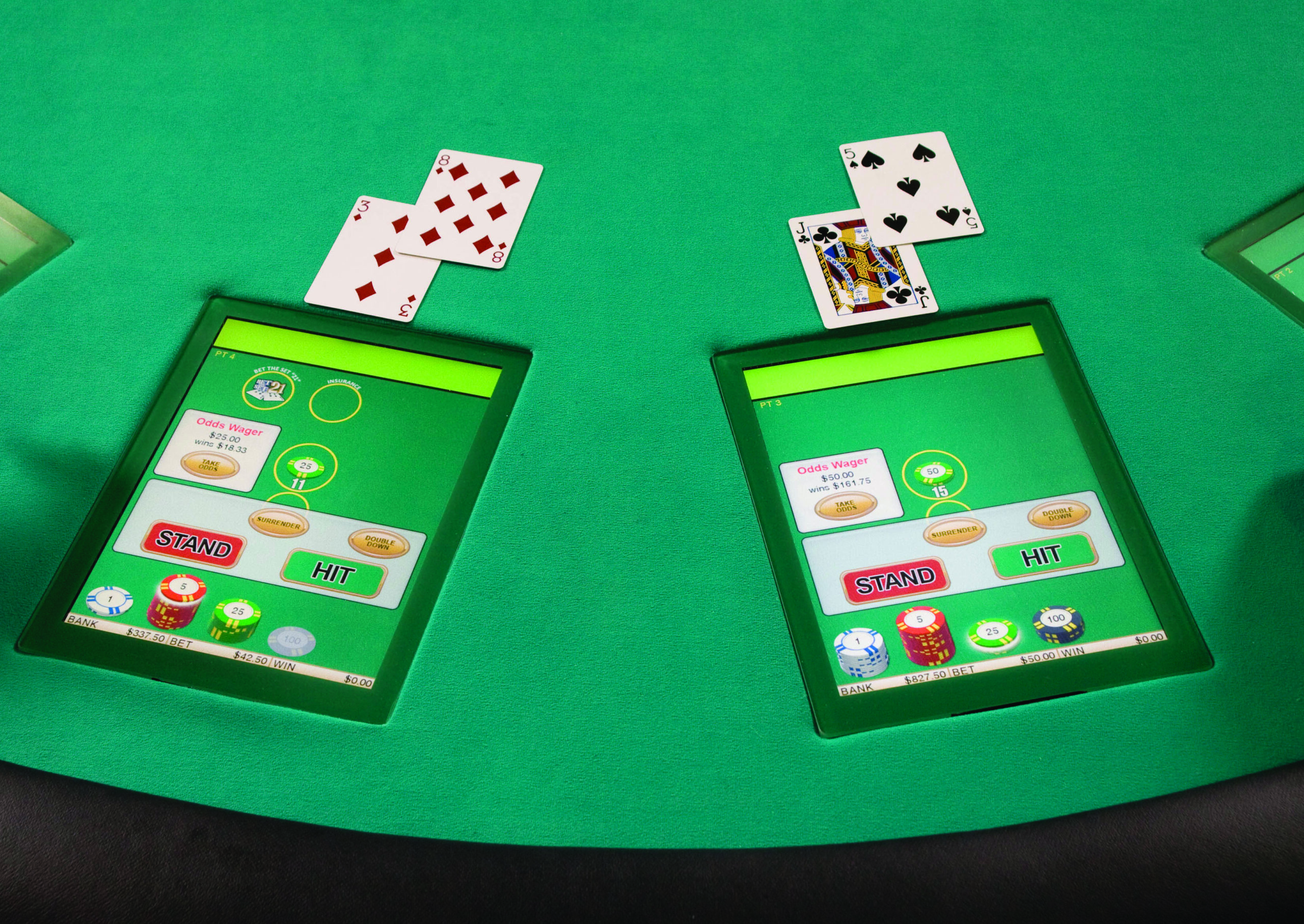 A touchscreen table with a game of black jack