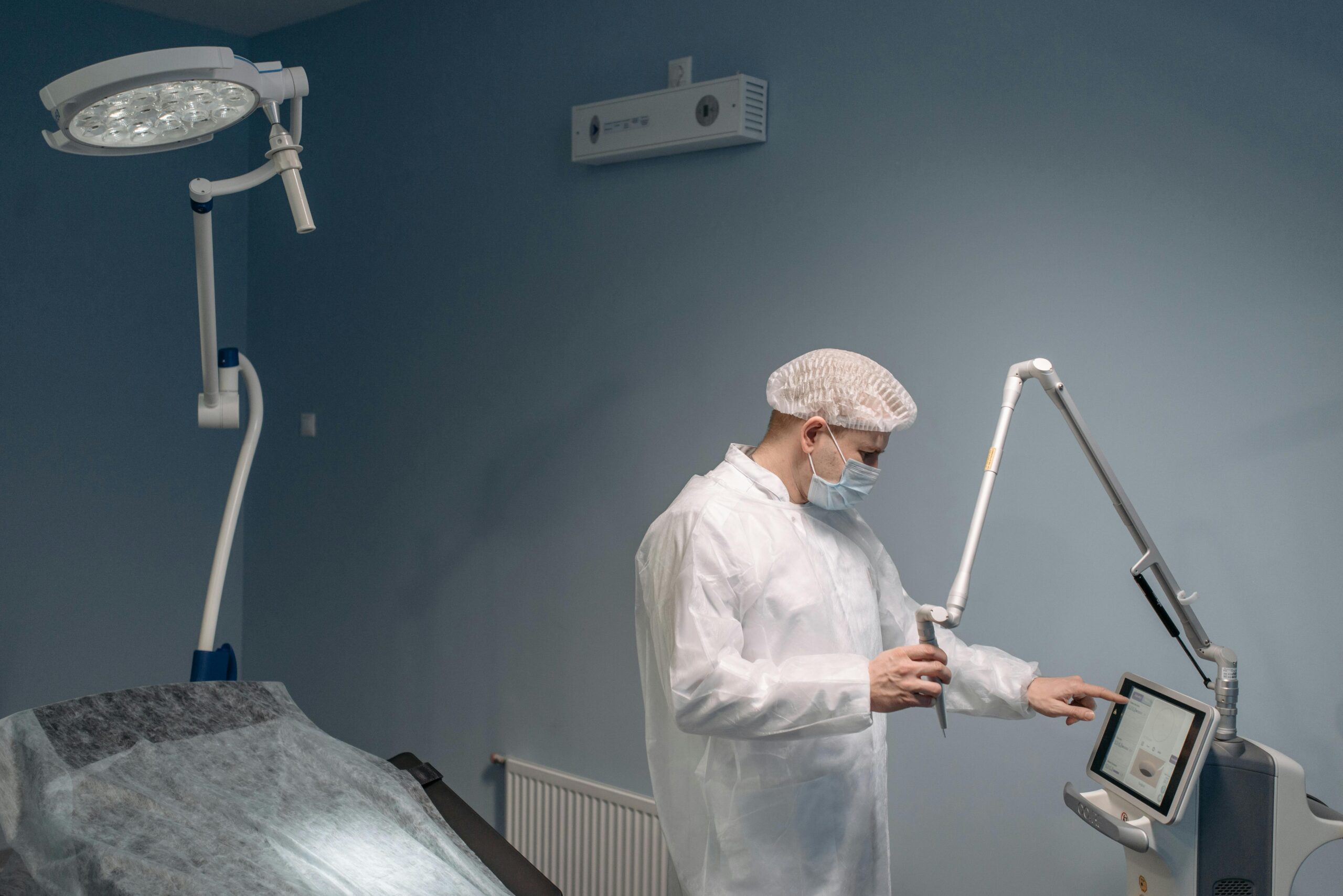 A doctor using a touchscreen device in the hospital