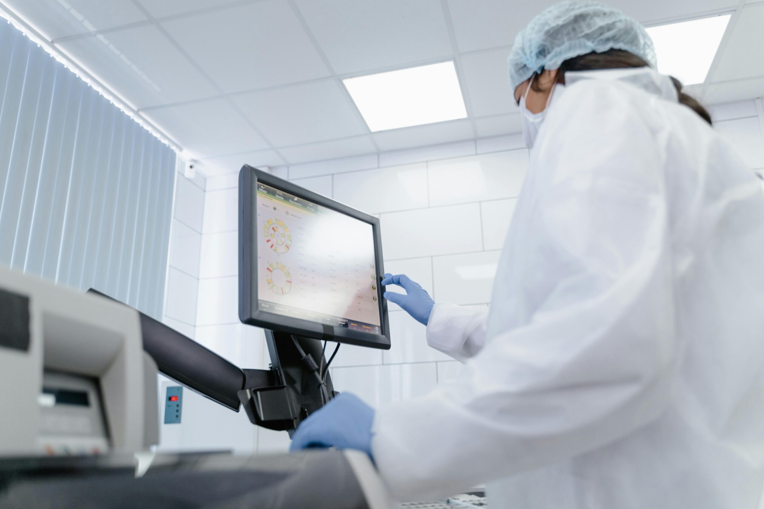 A doctor using a touchscreen device